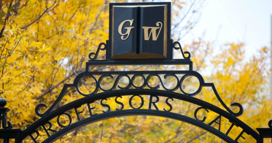 GW symbol on a campus gate overlooking campus