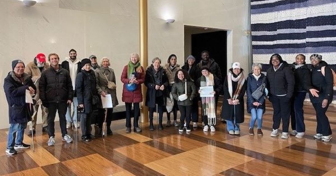 Group of students and community members posing for photo