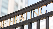 The word "Healing" on a campus gate