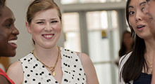 Alumni talking to one another at a networking event