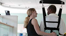 Physical therapist working with a patient in a clinic