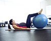 Pregnant woman working out on an exercise ball