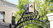 GW symbol on a campus gate overlooking campus