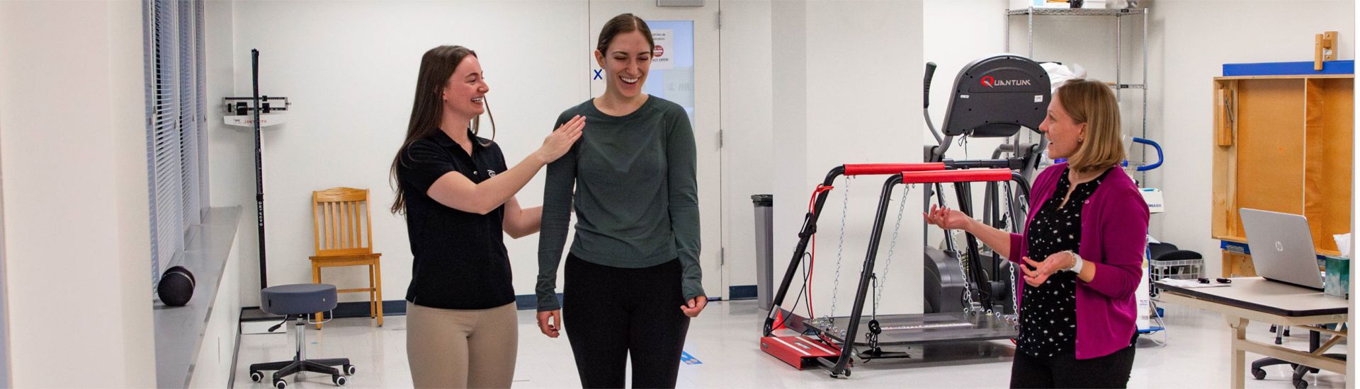 Physical Therapist assisting a person with shoulder pain